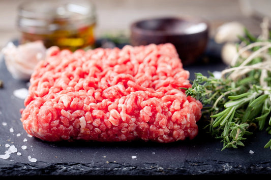 Minced meat on a slate stone black board.